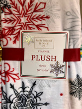 Load image into Gallery viewer, Flannel plush throw blanket with snowflake pattern and &#39;kathy ireland Home&#39; label.
