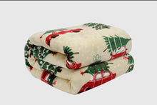 Load image into Gallery viewer, Folded blanket with Christmas-themed design on a white background
