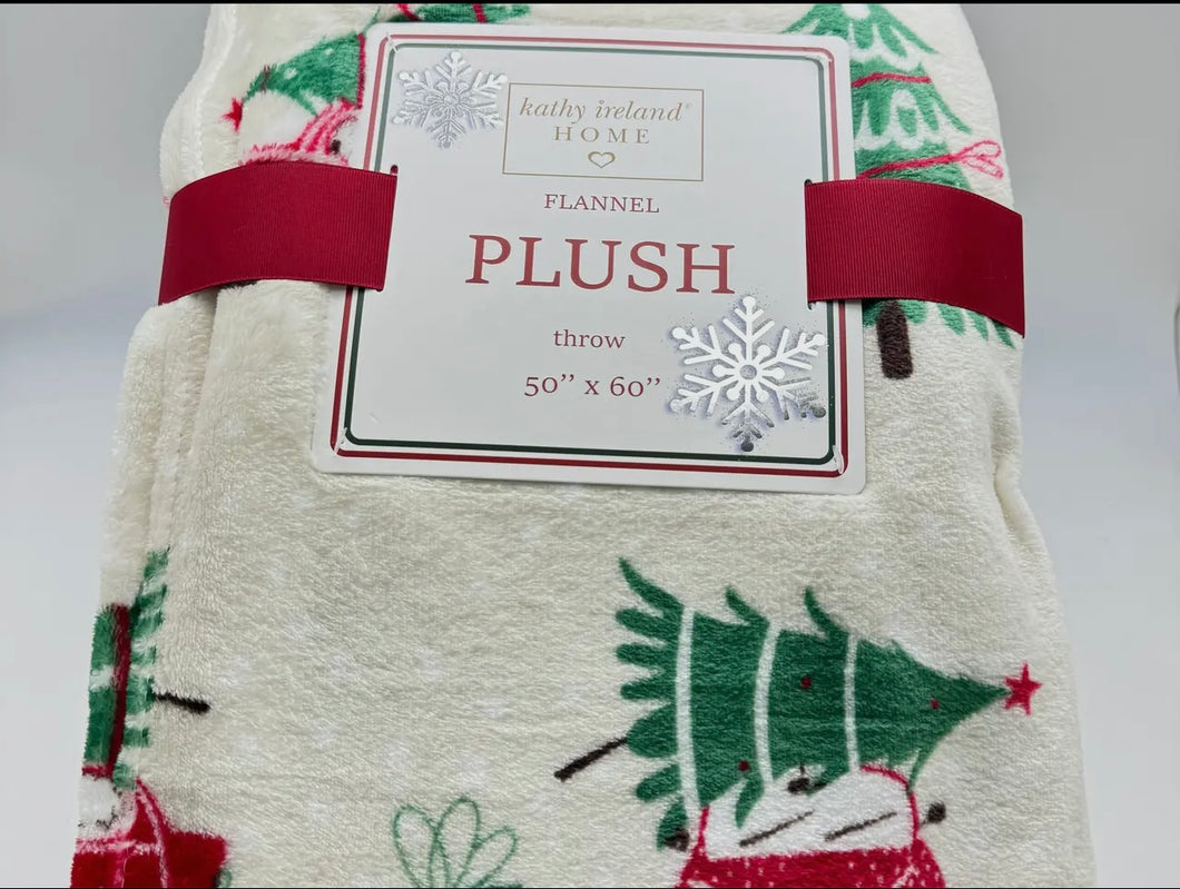 Flannel plush throw blanket with Christmas tree design and label on a white background